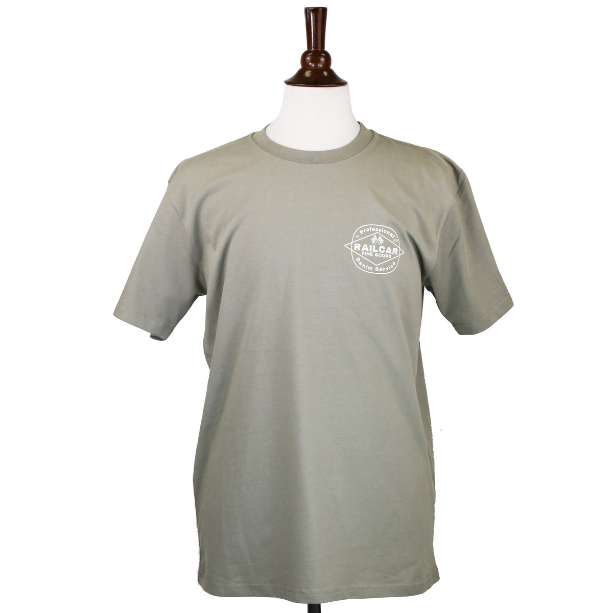 A sage green tee shirt with 'Professional Denim Service' and 'Railcar Fine Goods' printed in off white on the front.
